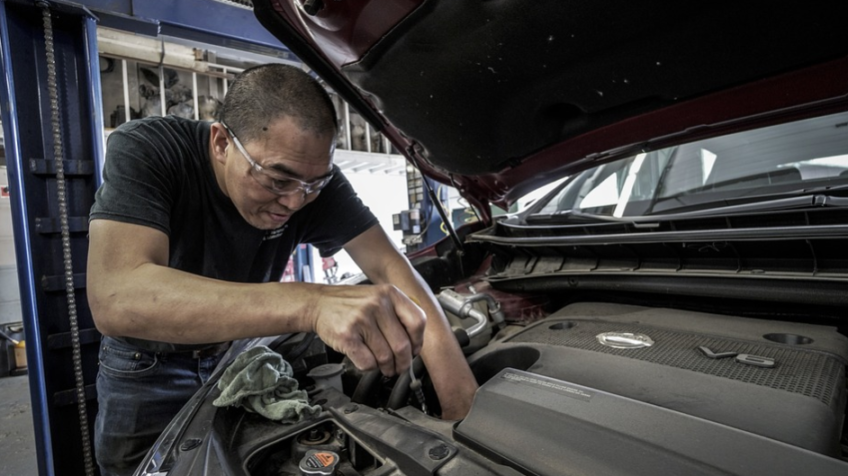 a mechanic repairing a car